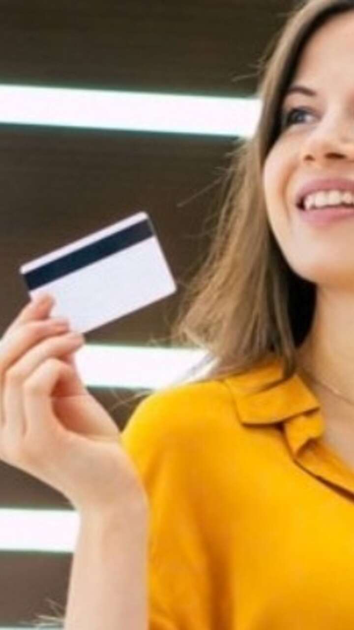 Woman shopping holding payment card