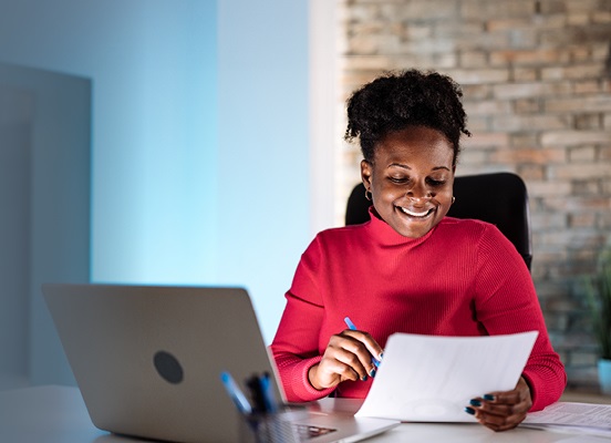 Woman looking at laptop