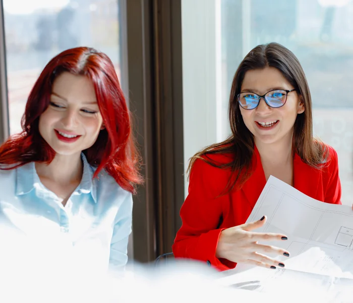 Two people looking at documents