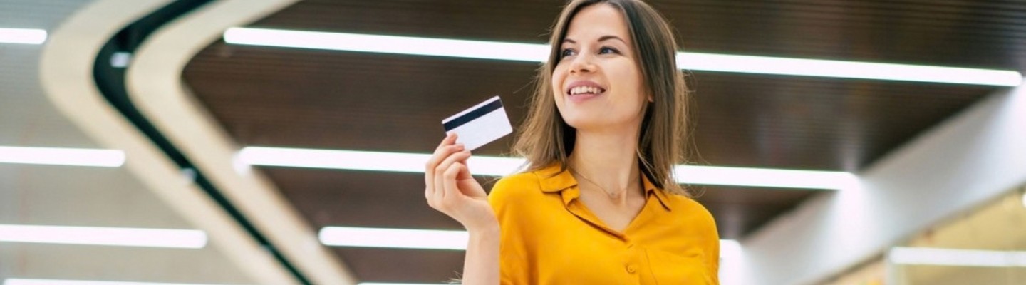 Woman shopping holding payment card