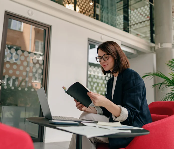 Woman looking at laptop