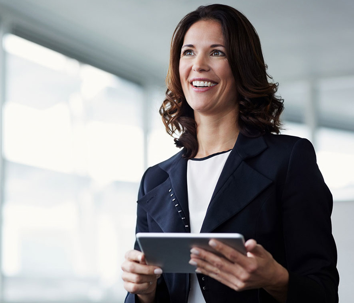 A woman standing with Ipad