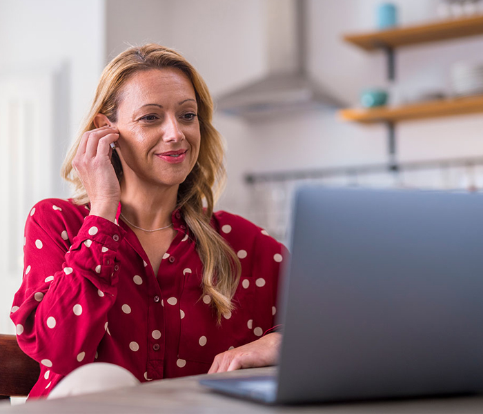 Woman looking at laptop