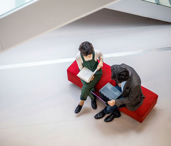 People looking at laptop
