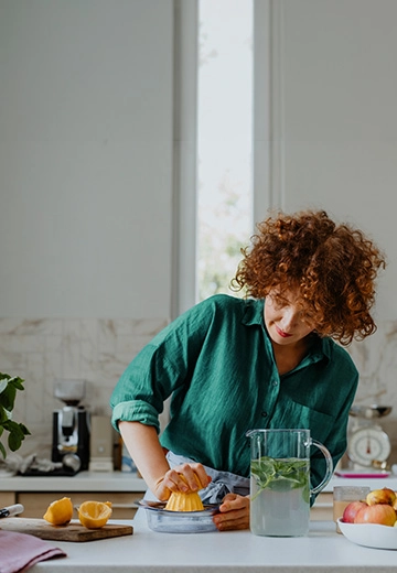 Woman squeezing lemon juice